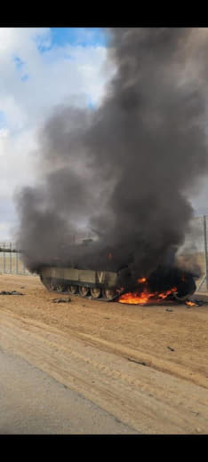 An Israeli military vehicle burned at the separation fence east of Gaza
