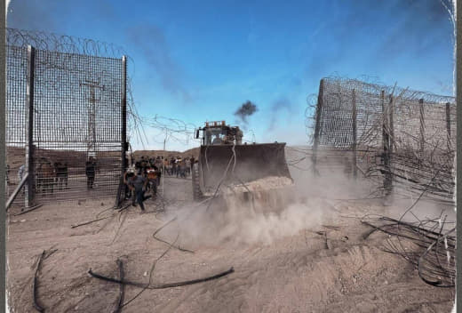 Palestinian bulldozers begin removing the separation wire along the Gaza Strip border