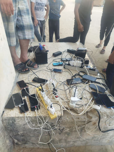 Life goes on...despite death Gazans charge phones with solar panels