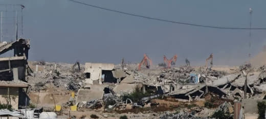 Israeli military vehicles continue demolishing civilians' homes in the vicinity of the Bani Suheila Roundabout, east of 
