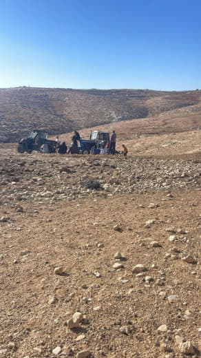 Settlers prevent citizens from plowing their lands in the Huwara area, east of Yatta, south of Hebron.