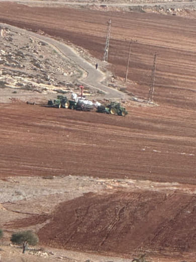 Settlers plow farmers' lands in the town of Al-Mughayir, northeast of Ramallah. They prevent citizens from accessing the