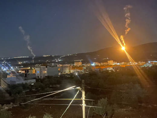 Occupation forces fire illare bombs in the atmosphere of the town of Aqaba, north of Tubas, north of the West Bank, as t