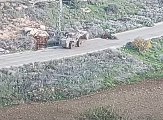 Israeli army bulldozers close the road linking the towns of Zababdeh and Qabatiya with dirt mounds south of Jenin