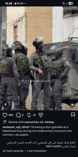 Northern Jerusalem Throwing a stun grenade at a Palestinian boy during the Israeli army’s incursion into northern Jerusa