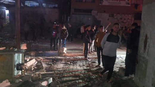 The aftermath of the shelling on a house in Al-Shati refugee camp.