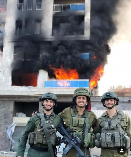 Hello! Please reply with the image of LieDF terrorists posing next to a burning UN school and mention if that is interna