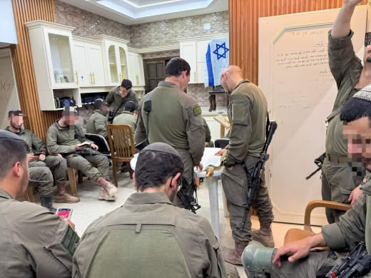 Reading of the Megilat Esther (the portion of the Torah recited on Purim) by the commander of the Nahshon Battalion in t