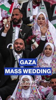 Around 300 Palestinian brides and grooms celebrate a mass wedding ceremony in central Gaza Strip's city of Deir el-Balah