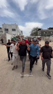 Palestinians mourn young man Hassan Ahmed, who was shot in the head while distributing bread to displaced people in fron