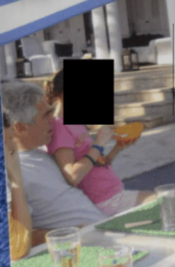 Epstein with a very young girl on his lap