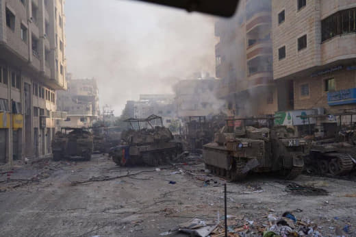A heart-warming scene of destroyed occupation tanks in the streets of downtown Gaza City.
