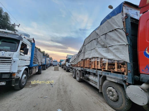 Trucks carrying wood enter Gaza through Karm Abu Salem crossing with Gaza.
