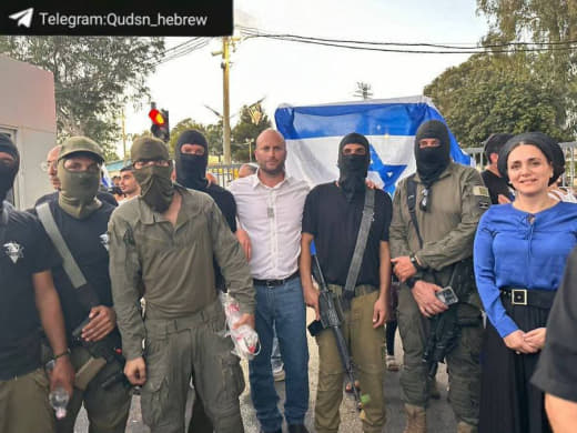 Hardcore Israeli MP Limor Son Har-Melech poses for a picture with a mob of extremist Jewish militants during their attac