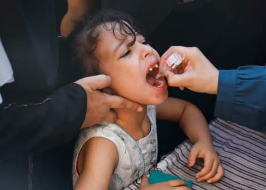 Palestinian families queued for polio vaccinations in Khan Yunis today.