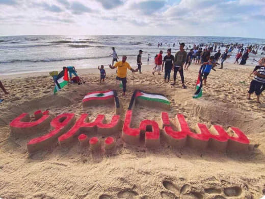 “Regards for Beirut” Palestinians create a large sand drawing on Gaza Beach, in support of the Lebanese civilians.