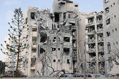 Scenes of destruction caused by an Iranian missile that struck a building in the city of Beersheba, southern occupied Pa